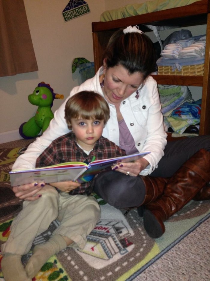 Desiree reading to her son